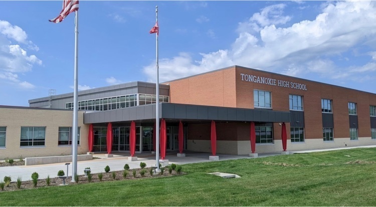 front exterior of Tonganoxie High School . flagpoles in foreground