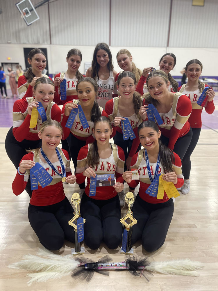 Chieftain Stars dance team members hold up ribbons 