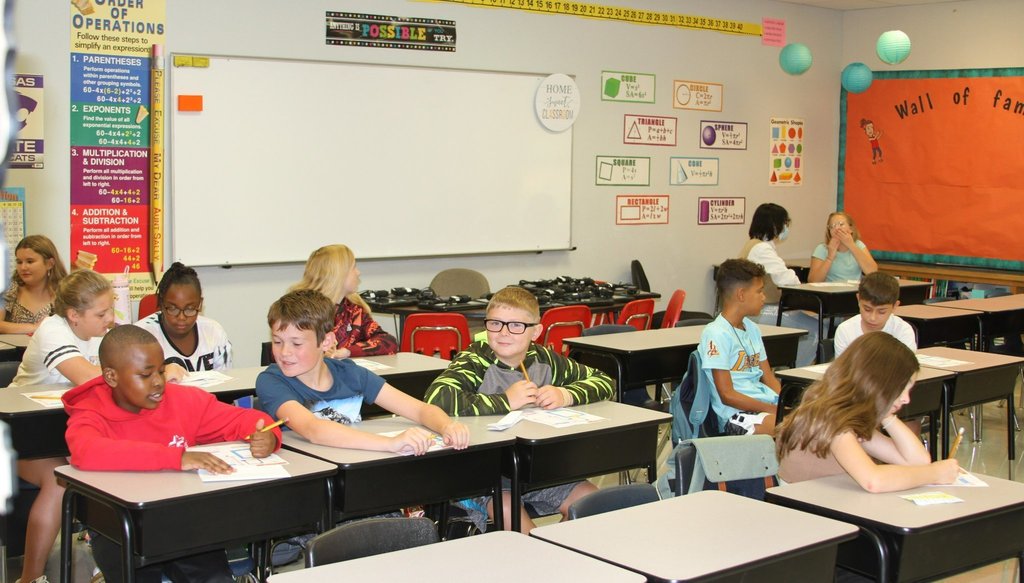 students in classroom middle school