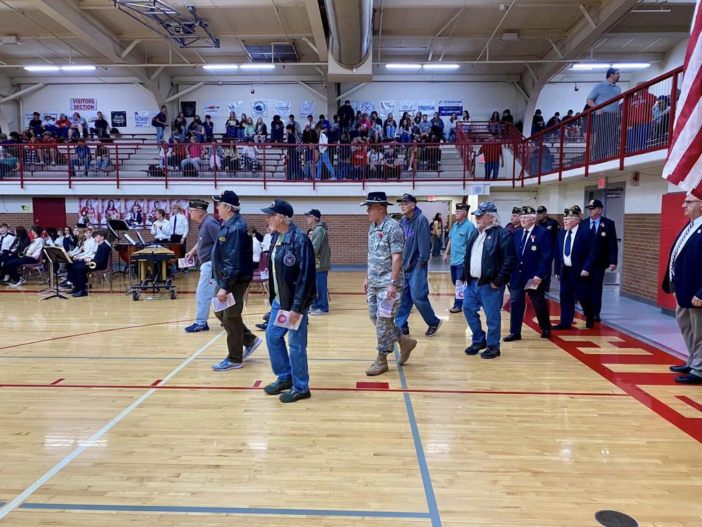 Veterans enter the gymnasium