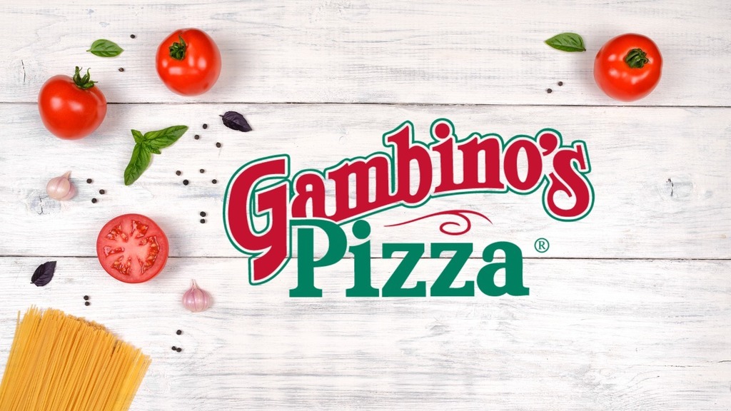 gambino's pizza logo. tomatoes, dried pasta, garlic and pepper on a white wooden background