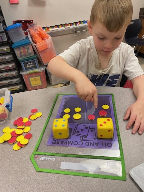student works with yellow and red counters during a math exercise