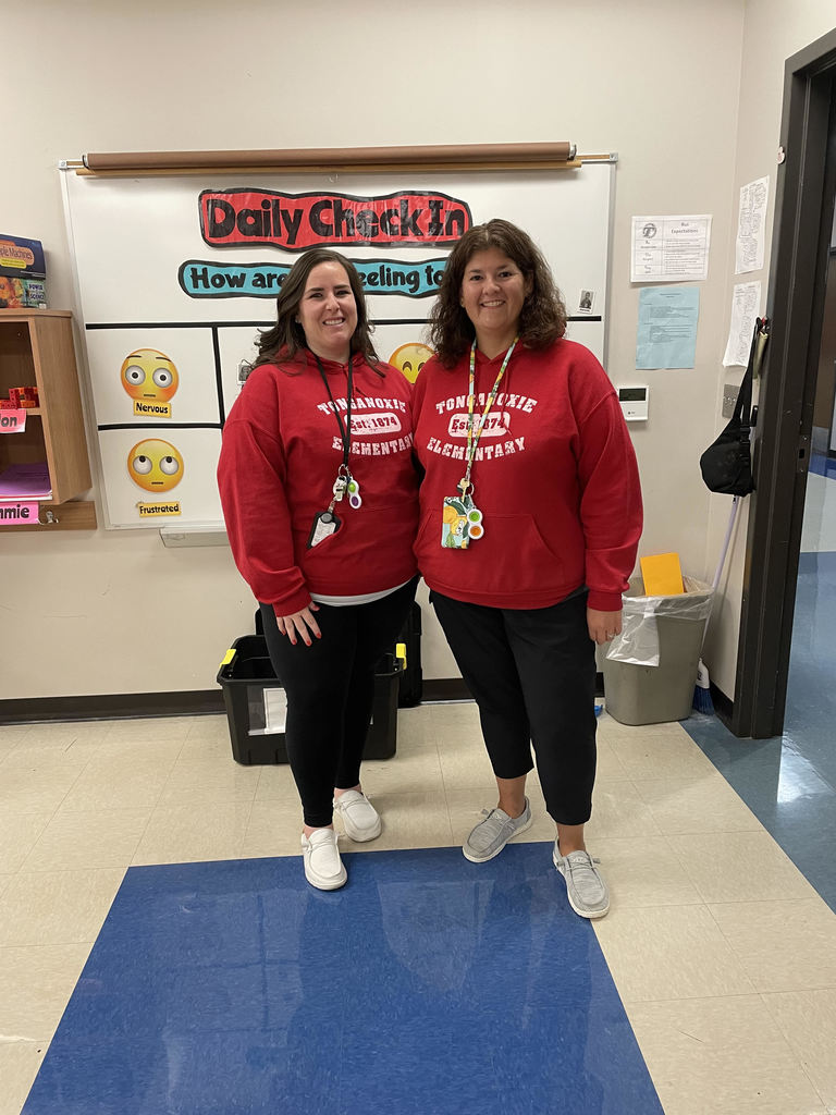 two teachers wearing red Tonganoxie Elementary sweatshirts