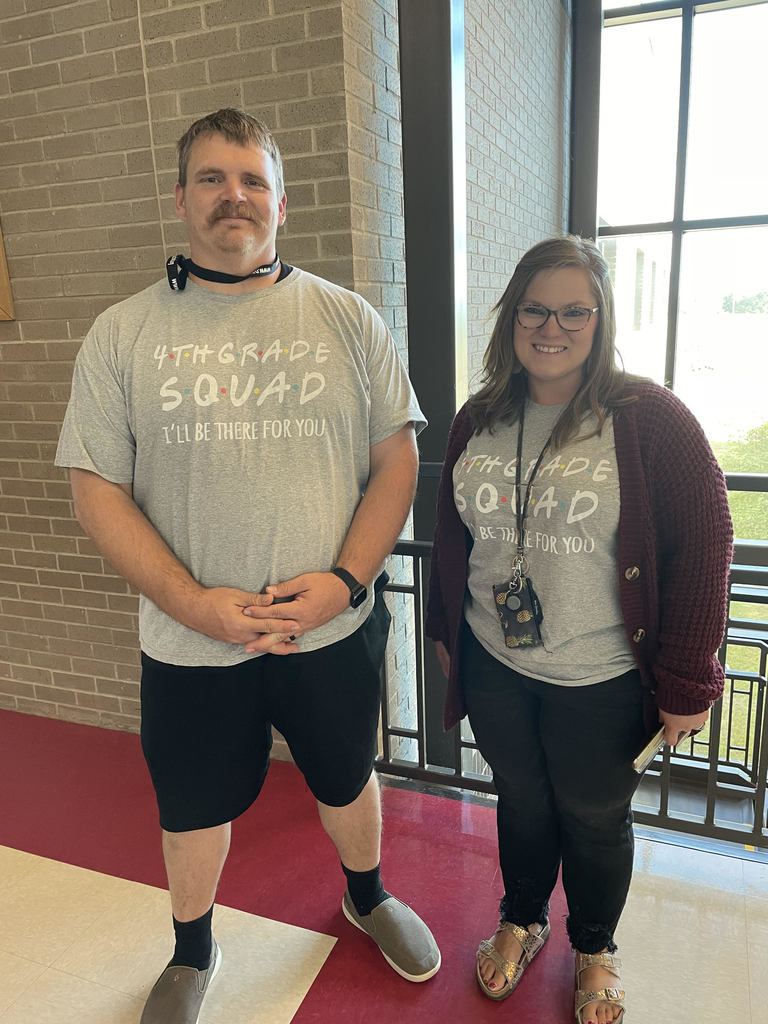 two teachers wearing gray t shirts 